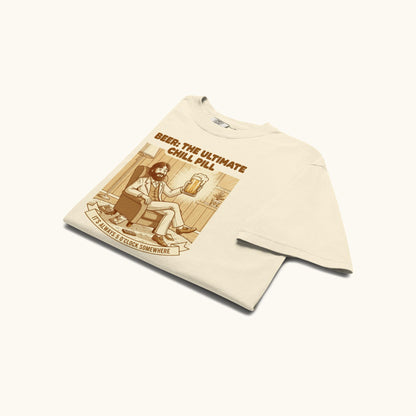 Unisex t-shirt with vintage illustration of a relaxed man holding a beer and the text Beer: The Ultimate Chill Pill.
